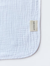 Load image into Gallery viewer, Baby Boss Baby Hooded Towel is made from extra soft, non-irritable and absorbent 4-layered organic cotton muslin which is perfect for wrapping your baby boss after their bath time. The towel contains no harmful dye or chemicals and is suitable for newborns and toddlers alike. The generous size of the towel and the practical hood ensure that your baby is kept dry and warm from head to toe. Dubai, Abu Dhabi, UAE