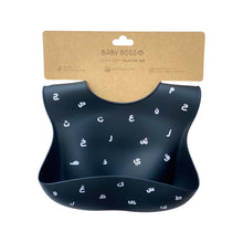 Load image into Gallery viewer, Baby Boss ME bib is made of ultra-soft food grade silicone (0% BPA, PVC and phthalates) and it comes with a comfortable & adjustable neck strap and a large spill pocket. The design features a unique Arabic alphabet pattern. The bib is quick and easy to clean, and the bib packaging is 100% biodegradable. Baby bib, kids bib, toddler bib. Dubai, Abu Dhabi, UAE.