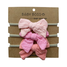 Load image into Gallery viewer, OUR HEADBAND SET includes three bows made of 100% cotton muslin. The soft elastic headband ensures that the bows fit comfortably on newborns and toddlers alike. Wash in no more than 30°C temperature. These bows are suitable for everyday wear and special occasions - and this set makes a perfect accessory for your baby boss! Dubai, Abu Dhabi, UAE. 
