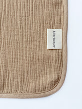 Load image into Gallery viewer, Baby Boss Baby Hooded Towel is made from extra soft, non-irritable and absorbent 4-layered organic cotton muslin which is perfect for wrapping your baby boss after their bath time. The towel contains no harmful dye or chemicals and is suitable for newborns and toddlers alike. The generous size of the towel and the practical hood ensure that your baby is kept dry and warm from head to toe. Dubai, Abu Dhabi, UAE
