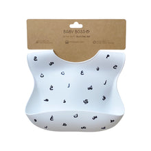 Load image into Gallery viewer, Baby Boss ME bib is made of ultra-soft food grade silicone (0% BPA, PVC and phthalates) and it comes with a comfortable &amp; adjustable neck strap and a large spill pocket. The design features a unique Arabic alphabet pattern. The bib is quick and easy to clean, and the bib packaging is 100% biodegradable. Baby bib, kids bib, toddler bib. Dubai, Abu Dhabi, UAE. 
